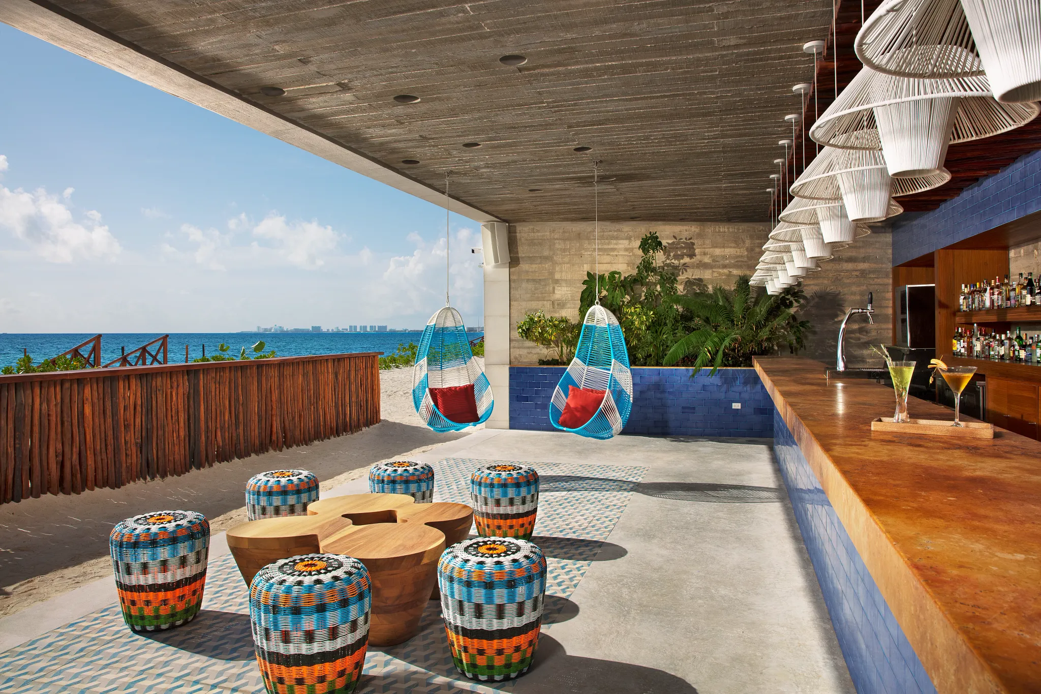 Barracuda Beach Bar at Dreams Vista Cancun featuring oceanfront seating, tropical cocktails, and scenic Caribbean Sea views.