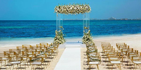 Beachfront wedding ceremony setup on Dreams Vista Beach at Dreams Vista Cancun Golf & Spa Resort