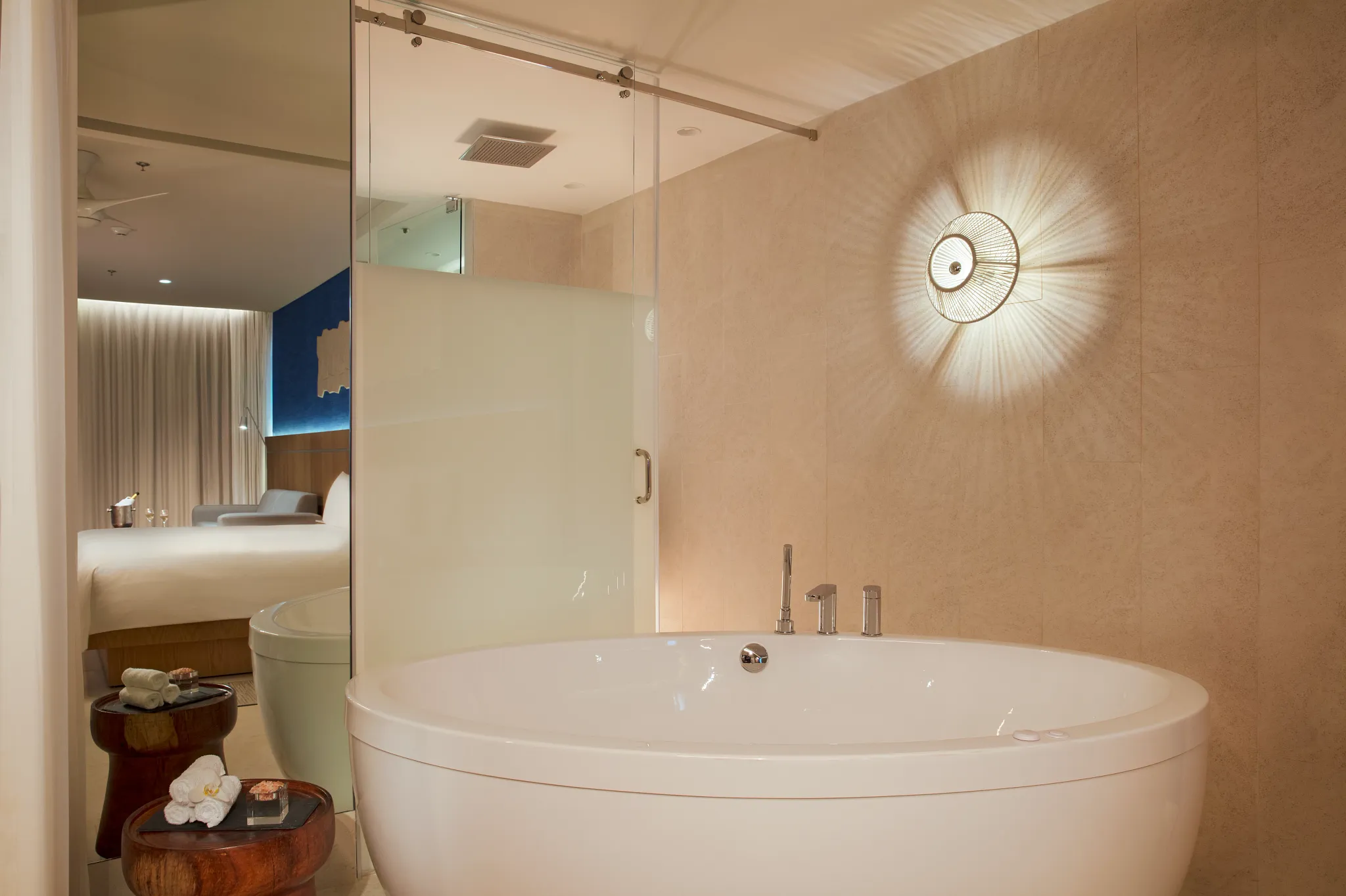 Preferred Club Honeymoon Suite bathroom with soaking tub and glass-enclosed rain shower at Dreams Vista Cancun.