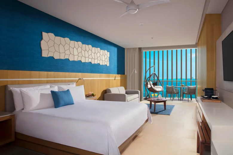 Preferred Club Honeymoon Suite Ocean View with king bed, private terrace, and ocean views at Dreams Vista Cancun.