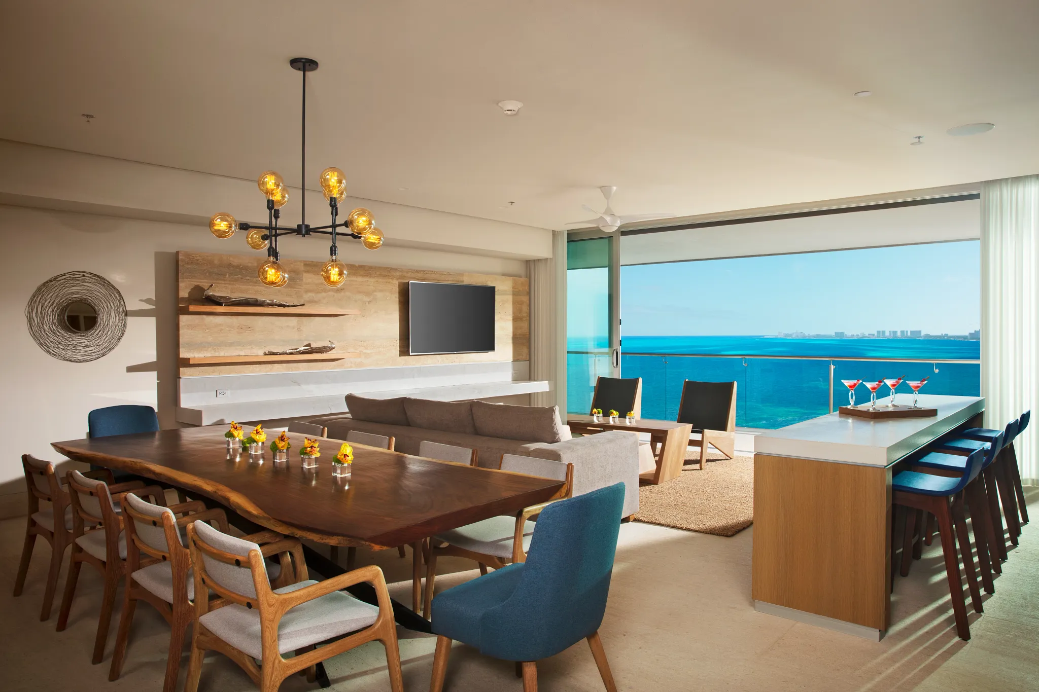 Presidential Suite Ocean Front living and dining area with ocean views and modern furnishings at Dreams Vista Cancun.