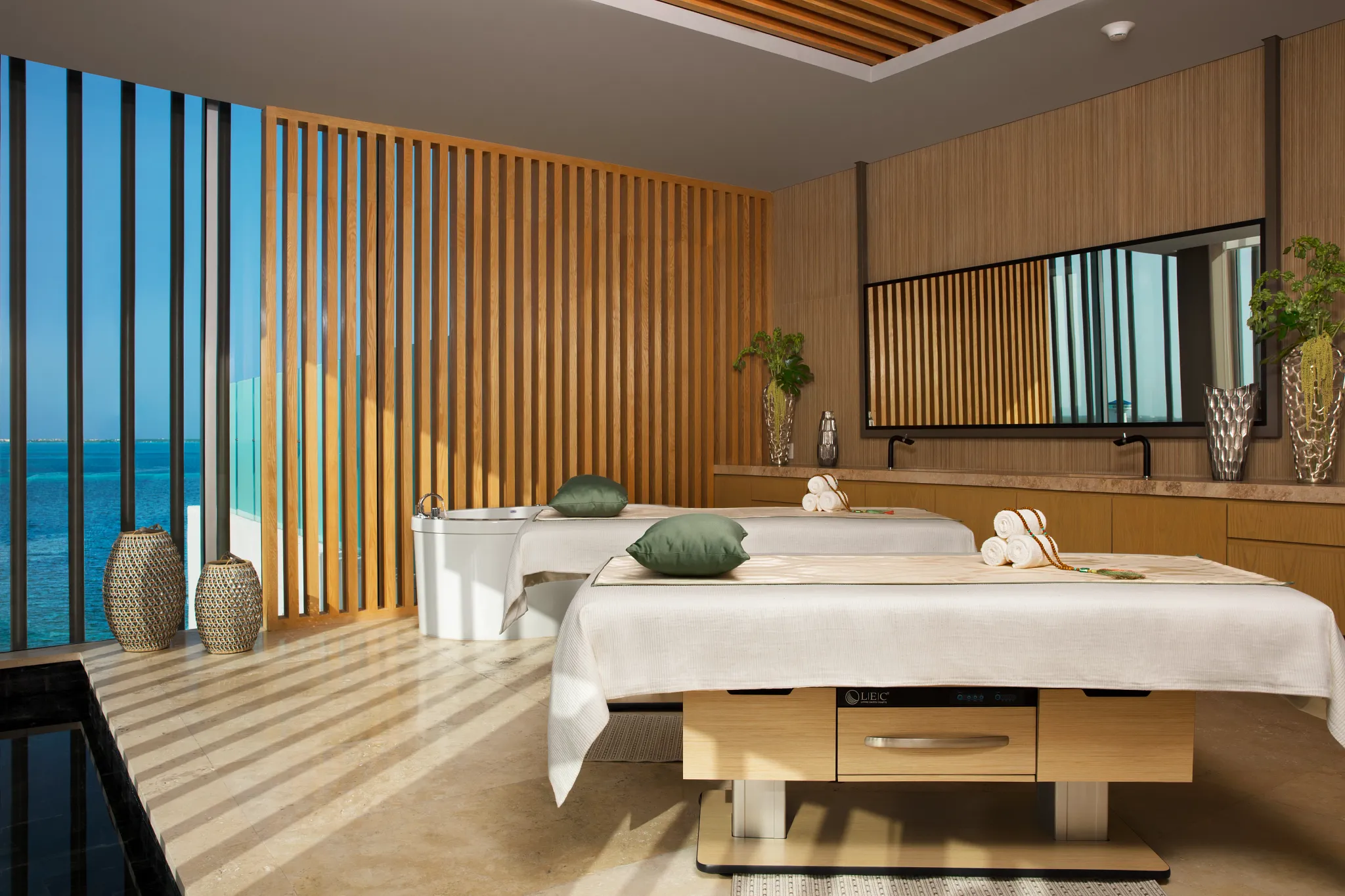 Couples massage room with ocean views at Dreams Vista Cancun Golf & Spa Resort.