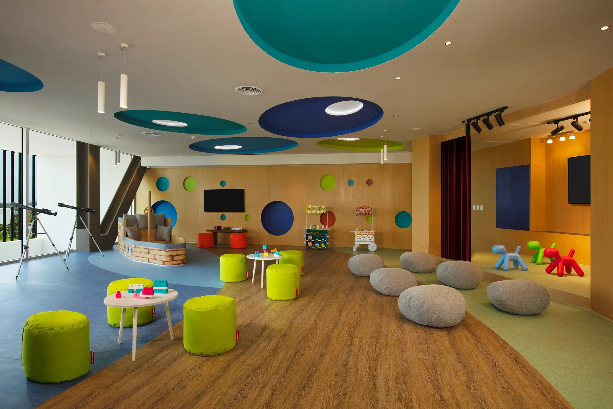 Bright kids club playroom with colorful seating and toys at Dreams Vista Cancun Golf & Spa Resort.