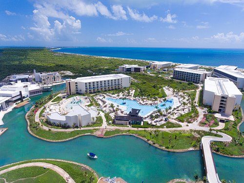 Grand Palladium Costa Mujeres Resort & Spa featuring expansive pools, lush grounds, and beachfront luxury in Costa Mujeres, Mexico.