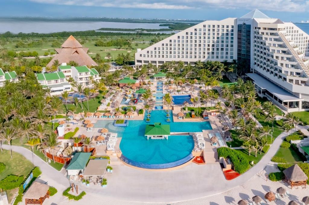 Iberostar Selection Cancun all-inclusive resort with beachfront setting, multiple pools, and pyramid-style architecture in Cancun's Hotel Zone.
