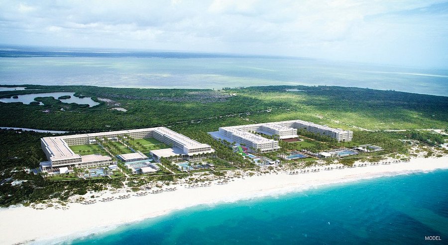 Riu Palace Costa Mujeres all-inclusive resort with expansive pools, beachfront location, and grand architecture in Costa Mujeres, Mexico.