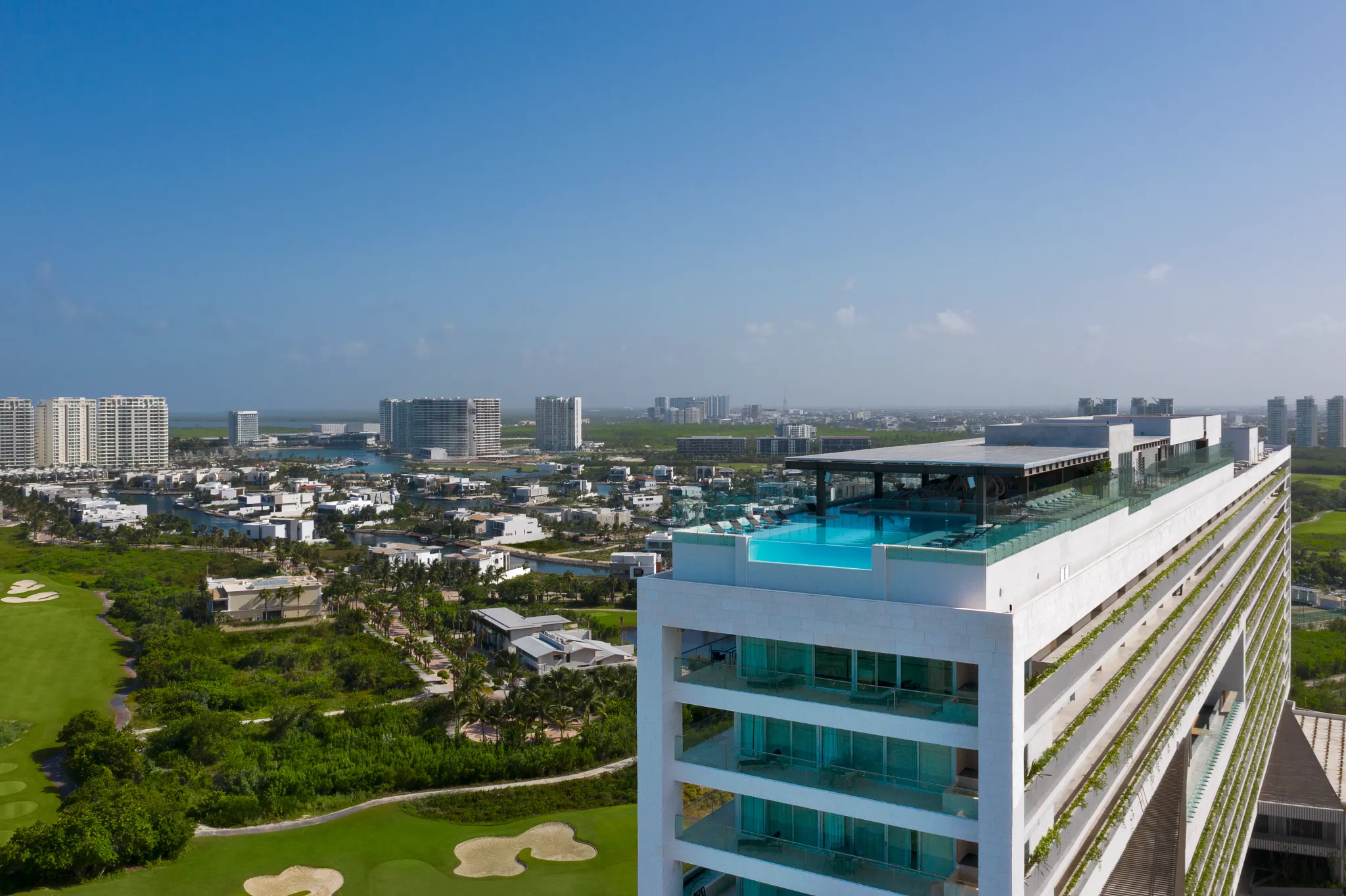 Rooftop infinity pool with panoramic views at Dreams Vista Cancun Golf & Spa Resort in Cancun.