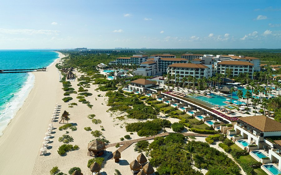 Secrets Playa Mujeres Golf & Spa Resort luxury adults-only all-inclusive with infinity pools, spa facilities, and pristine Playa Mujeres beach.