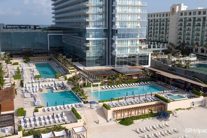 Secrets The Vine Cancun adults-only all-inclusive resort with sleek modern tower, infinity pools, and beachfront location in Cancun Hotel Zone.