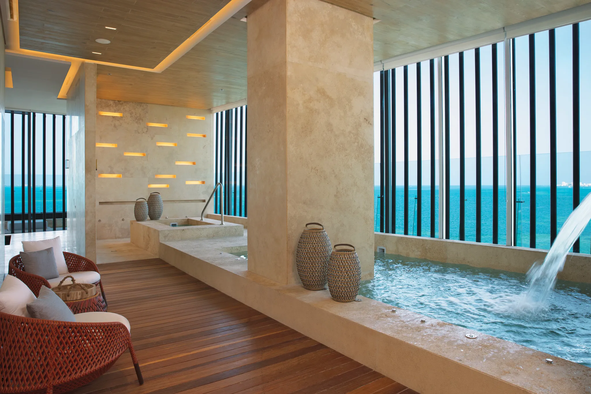 Hydrotherapy spa circuit with pools and ocean views at Dreams Vista Cancun Golf & Spa Resort.